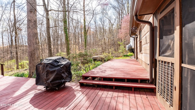 wooden terrace with area for grilling