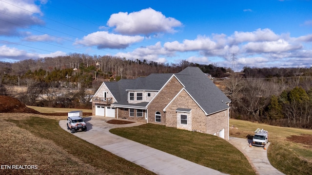 view of front facade with a front lawn and a garage