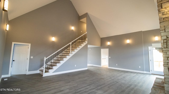 interior space featuring high vaulted ceiling and dark hardwood / wood-style floors