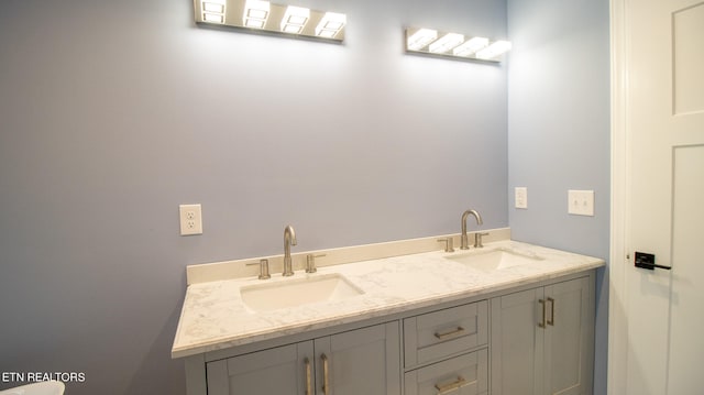 bathroom featuring double vanity