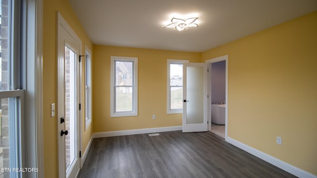 empty room featuring dark wood-type flooring