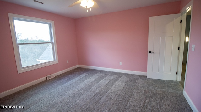 carpeted empty room featuring ceiling fan