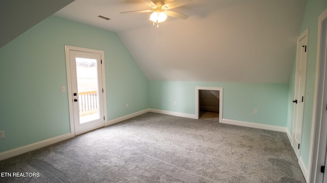 bonus room with ceiling fan, vaulted ceiling, and dark carpet