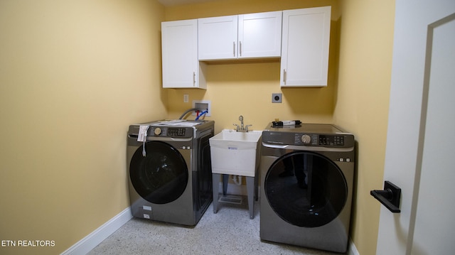 laundry area with washer and clothes dryer, cabinets, washer hookup, and electric dryer hookup