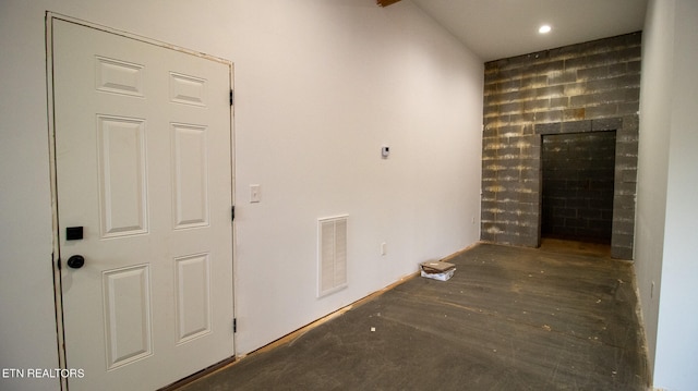 corridor with dark hardwood / wood-style flooring