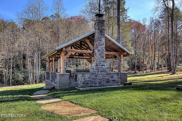 exterior space featuring a gazebo and a lawn