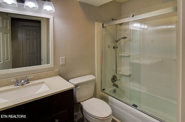 full bathroom featuring toilet, vanity, and combined bath / shower with glass door