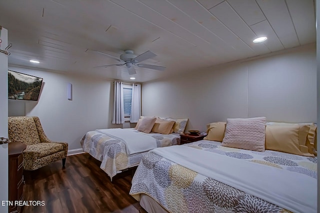 bedroom with ceiling fan and dark wood-type flooring