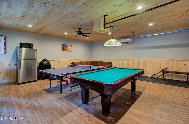 rec room with a wall unit AC, ceiling fan, wood ceiling, billiards, and light wood-type flooring