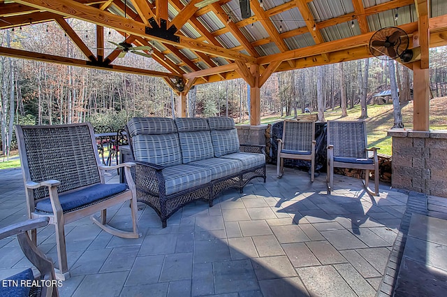 view of patio with an outdoor hangout area, a gazebo, and ceiling fan