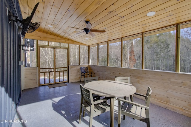 sunroom featuring lofted ceiling, ceiling fan, and wooden ceiling