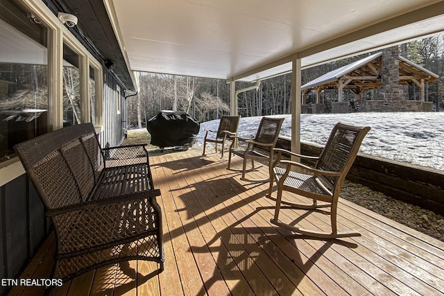 snow covered deck with area for grilling