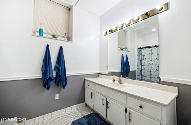 full bathroom featuring vanity, a shower with curtain, and tile patterned flooring