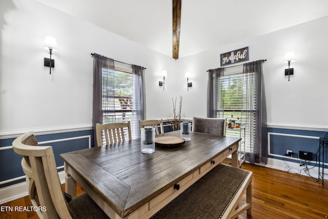 dining room featuring wainscoting, wood finished floors, and plenty of natural light