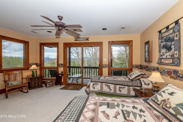 bedroom with carpet flooring, multiple windows, access to outside, and ceiling fan