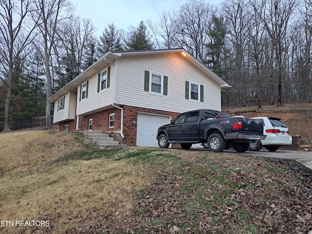 view of home's exterior with a lawn and a garage