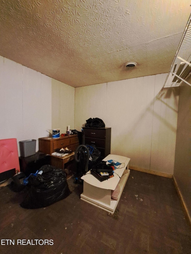 spacious closet with dark wood-type flooring