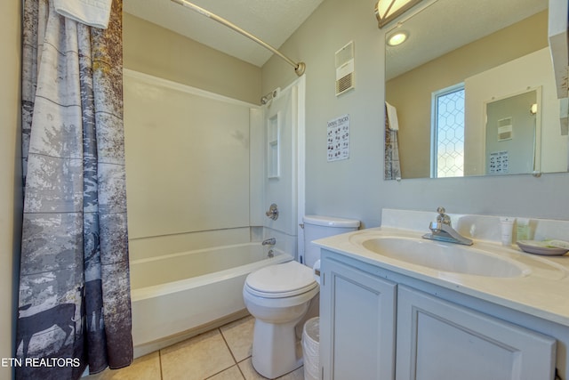 full bathroom featuring toilet, a textured ceiling, vanity, shower / bath combination with curtain, and tile floors