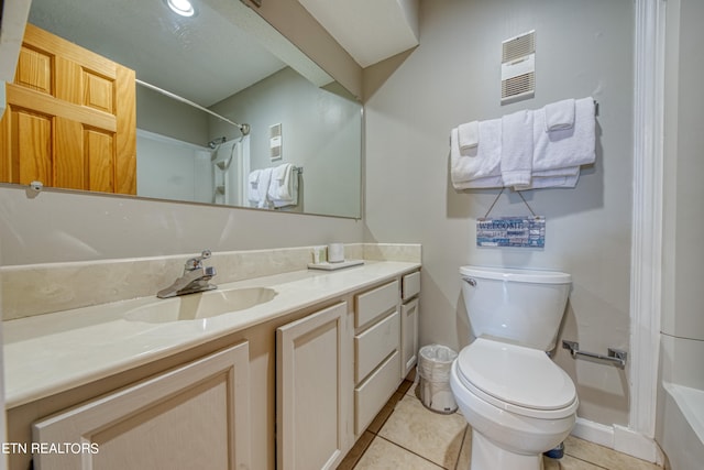 full bathroom featuring tile floors, toilet, vanity, and bathing tub / shower combination