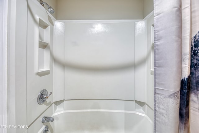 bathroom with shower / tub combination