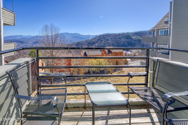 balcony featuring a mountain view