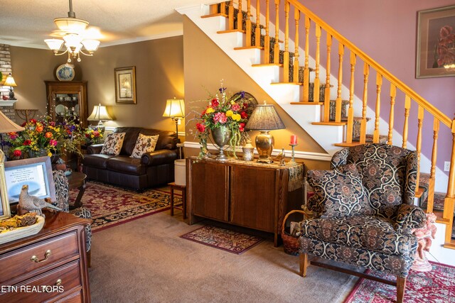 352 Rutherford Dr, New Tazewell, TN 37825 - carpeted living room with a textured ceiling, brick wall, a chandelier, and crown molding