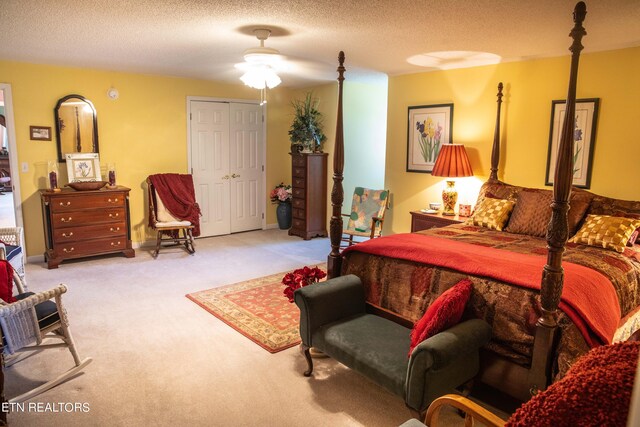 352 Rutherford Dr, New Tazewell, TN 37825 - bedroom featuring a closet, light carpet, a textured ceiling, and ceiling fan