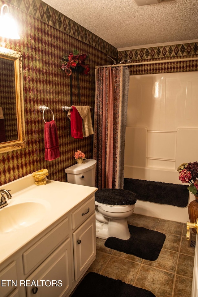 352 Rutherford Dr, New Tazewell, TN 37825 - bathroom featuring a textured ceiling, tile floors, oversized vanity, and toilet
