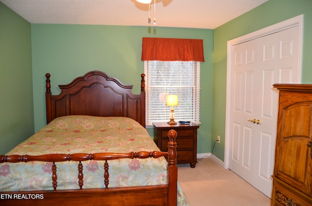 bedroom featuring carpet flooring and a closet