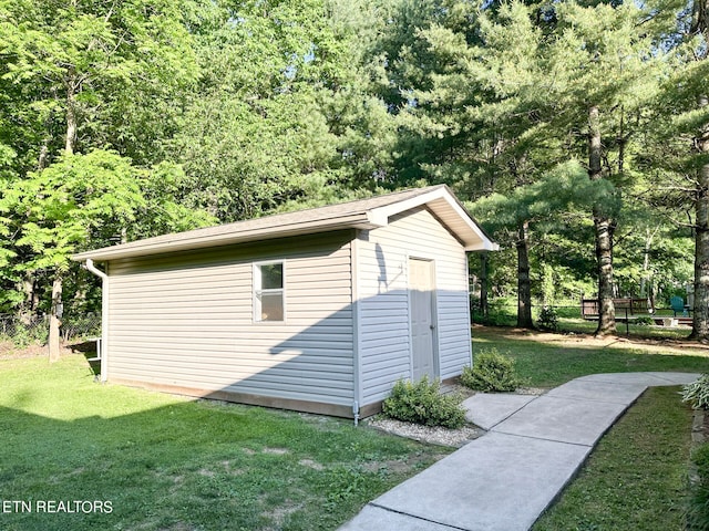 view of outdoor structure with a yard