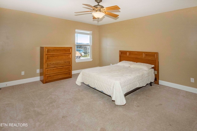 bedroom with ceiling fan and carpet