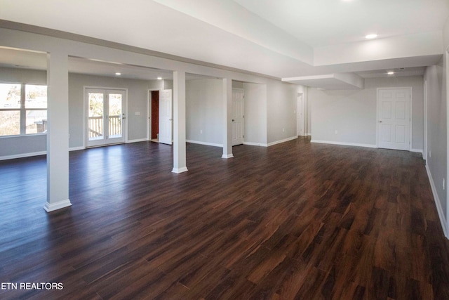 basement with dark hardwood / wood-style flooring