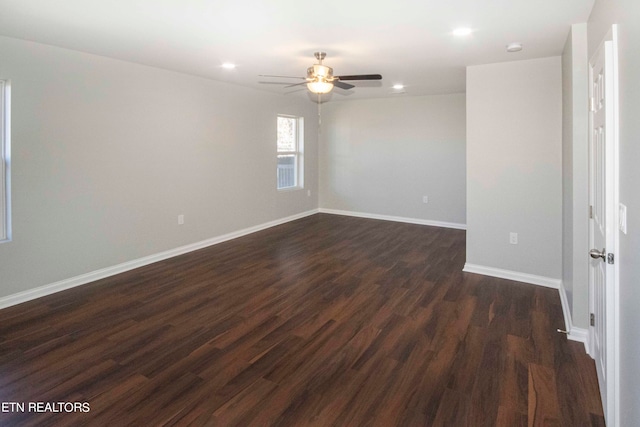 unfurnished room with dark wood-type flooring and ceiling fan