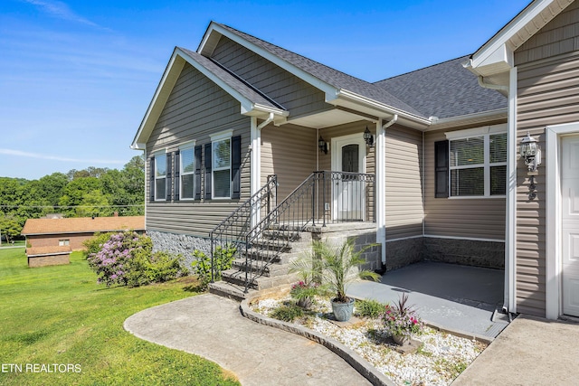 view of front of home with a front yard