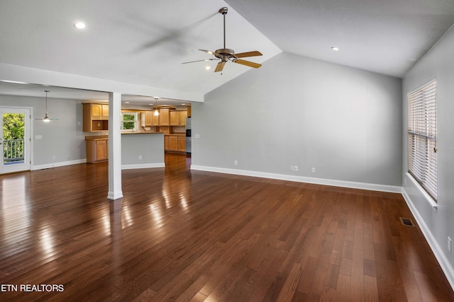 unfurnished living room with high vaulted ceiling, ceiling fan, and dark wood-type flooring