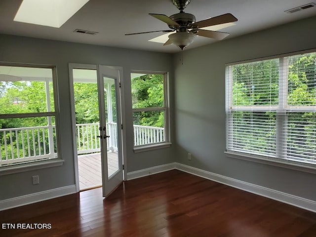 doorway to outside featuring ceiling fan and dark wood-type flooring