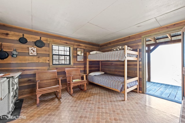 bedroom with wooden walls