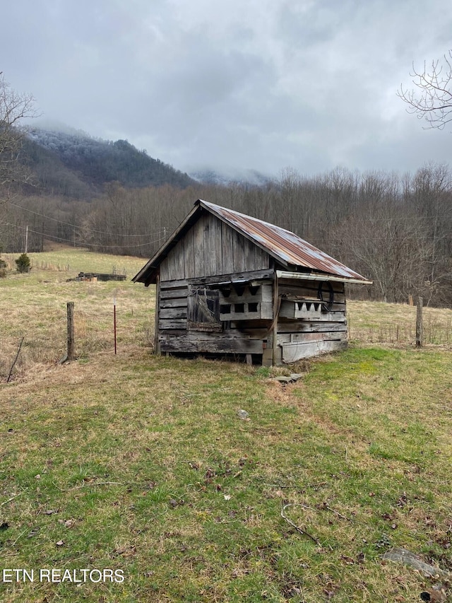 exterior space with a lawn and a rural view