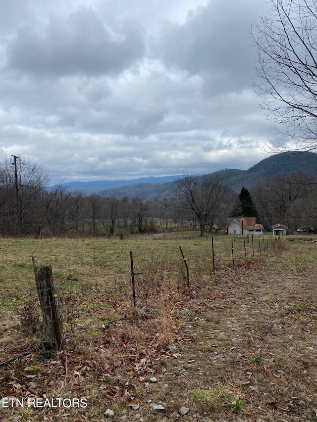 mountain view featuring a rural view