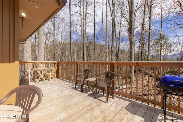 wooden deck featuring grilling area