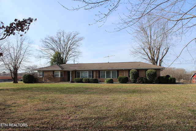 ranch-style home featuring a front yard