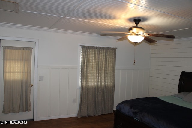 bedroom featuring dark hardwood / wood-style flooring and ceiling fan