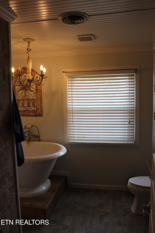 bathroom with a notable chandelier, ornamental molding, and toilet