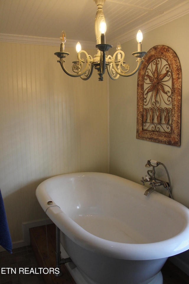 bathroom featuring crown molding and a chandelier