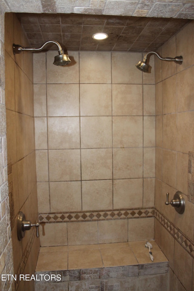 bathroom with a tile shower