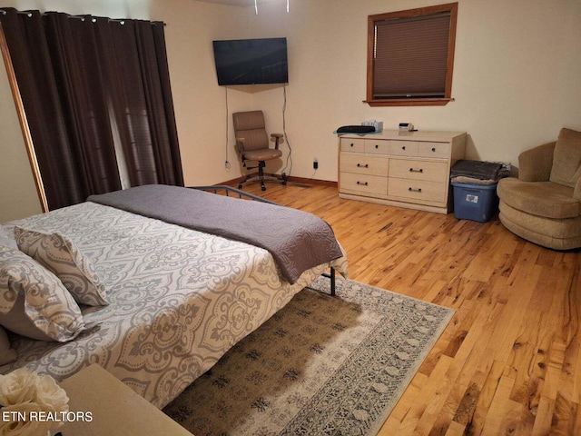 bedroom with light hardwood / wood-style floors