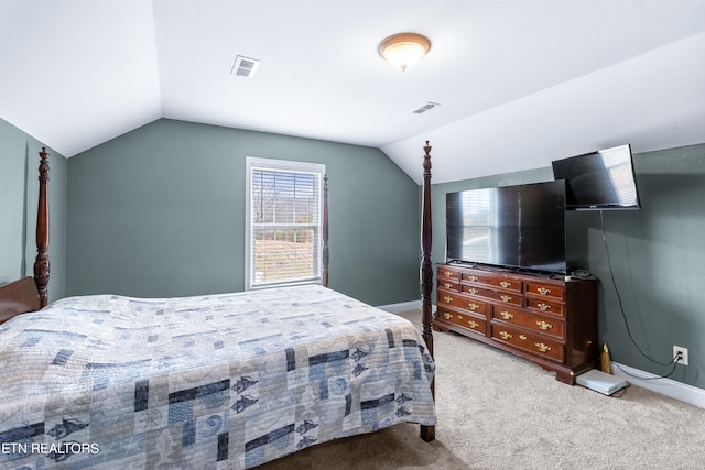 carpeted bedroom with vaulted ceiling