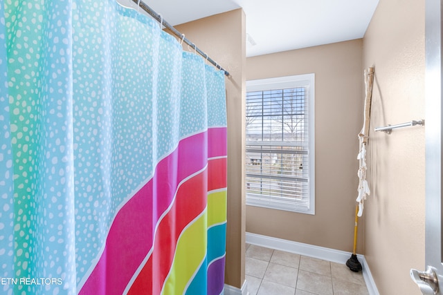 bathroom with tile flooring