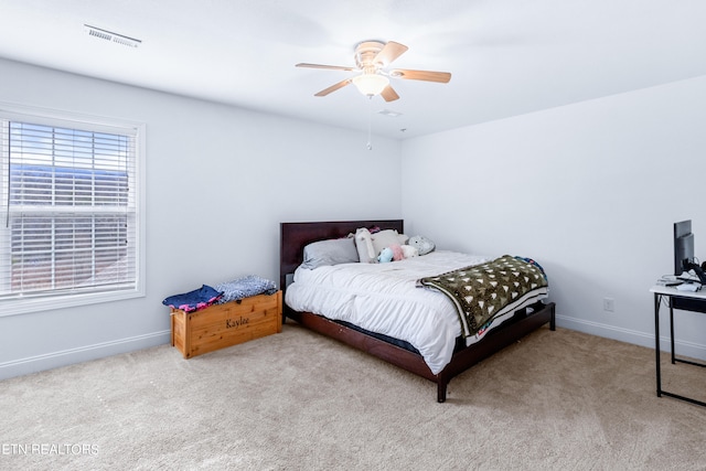 carpeted bedroom with ceiling fan