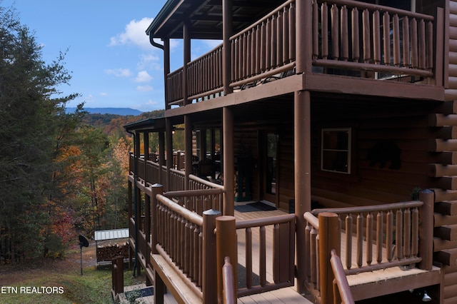 wooden terrace with a mountain view